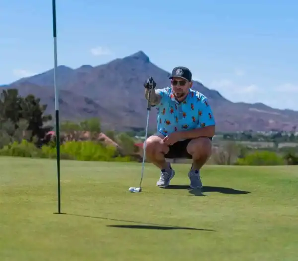 eyeing a putt at turtleback mountain golf and resort