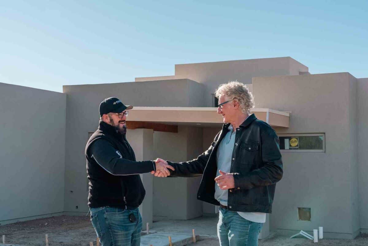 james prendamano and david berman shaking hands